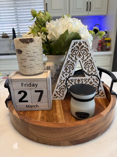 Customer's small Oatmeal, Milk & Honey Candle on a decorative wooden tray with other home decor.