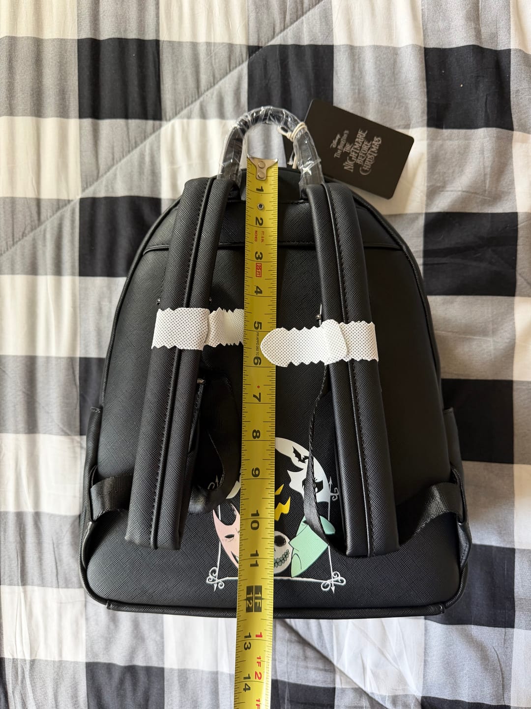 Customer photo review of Loungefly Disney Nightmare Before Christmas Glow in the Dark Lock, Shock, and Barrel Triple Pocket Mini Backpack - 707 Street Exclusive