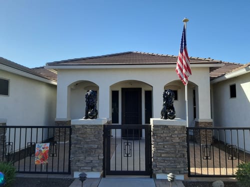 Customer's Ultra Heavy Duty American Flag on a flagpole in front of their home.