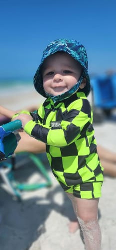 Customer photo review of UPF50+ Boys Swim Romper in Neon Electric Lime + Black Checkered