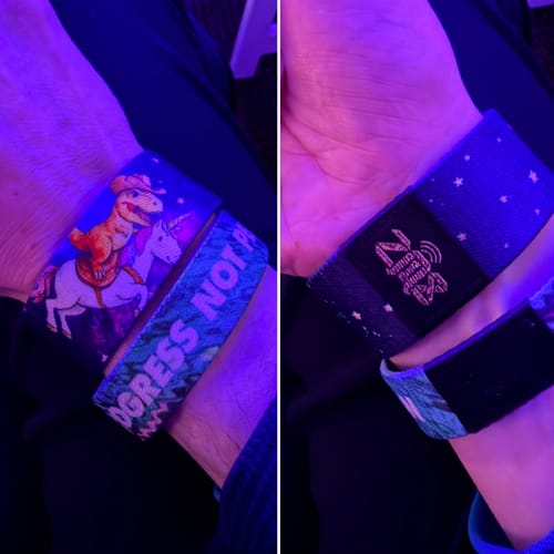 Customer wearing a Beyond The Stars Collection bracelet featuring a dinosaur riding a unicorn.