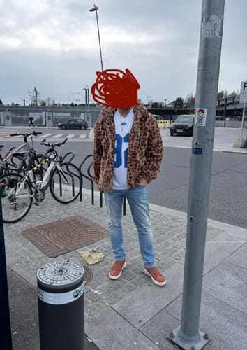 Customer wearing the Faux Fur Leopard Zip Up Hooded Coat outdoors with a relaxed fit.
