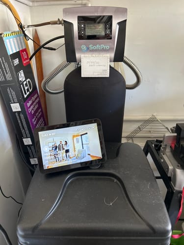 Customer's installed SoftPro® Elite HE Water Softener with its silver digital control panel visible in a utility room.