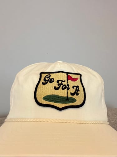 Customer's white Big Flat Bill Unstructured Rope Hat with a decorative 'Go For It' golf patch on the front.