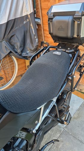 A customer's black mesh Wind Rider Seat Cover installed on a motorcycle seat.