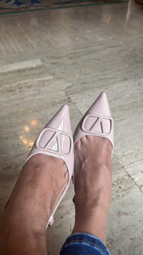 A reviewer's view of their elegant beige Paulina Sling back Kitten Heels on their feet.