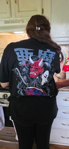 Reviewer seen from behind wearing the black DARK GEISHA TEE, showcasing the large graphic on the back.