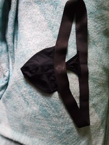 A customer's black Nylon Mesh Thong laid out, highlighting the pouch and string waistband.