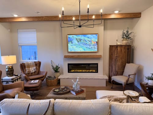 Customer's living room featuring the Dimplex Ignite Evolve electric fireplace beautifully installed in a wall.