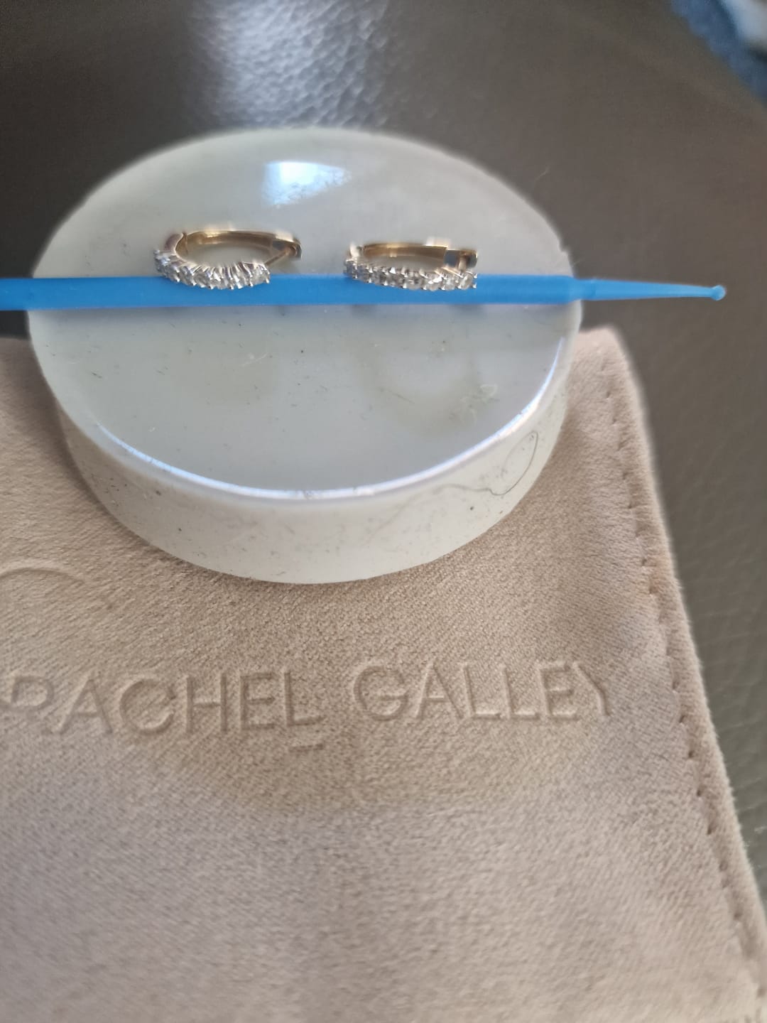 Customer photo review of Versa Single Spark Lab Grown Diamond Huggies Hoop Earrings