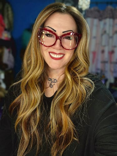 Customer wearing the long, wavy Outre LORENA wig in the Honey Glazed Brown color.