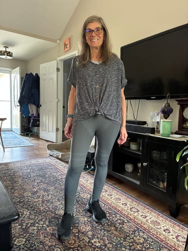 Reviewer standing indoors wearing the grey, textured Silix™ 3D Anti-Cellulite Leggings.