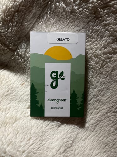Reviewer's packaging for the Gelato Pre-Roll 1 Gram from Clean Green, resting on a soft white surface.