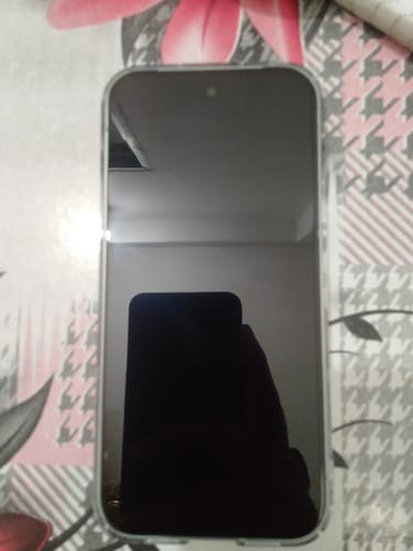 Customer's phone with the UltraShield Tempered Glass applied, showing a clean and reflective screen.