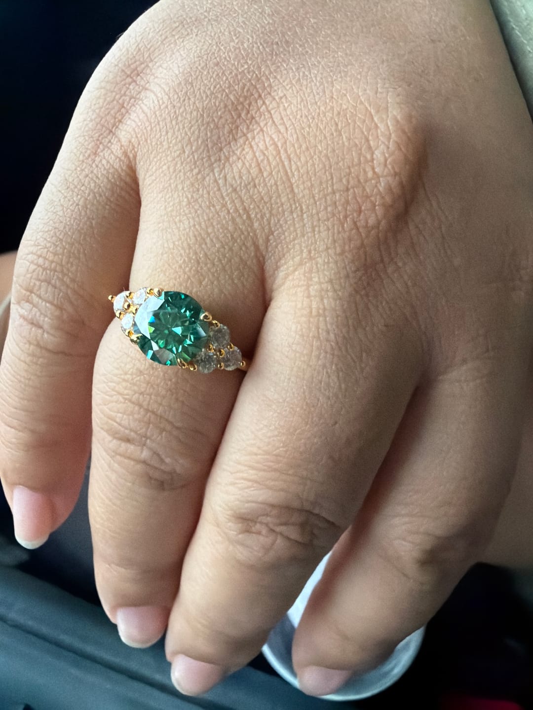 Customer photo review of Green Moissanite Side Stone Engagement Ring