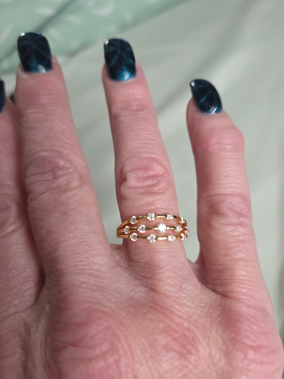 Customer photo review of Triple Strand Band Tension Set Moissanite Wedding Band Ring