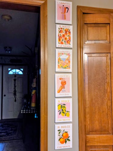 Reviewer's completed 6 Mini Paintings from the Italian 'Dolce Vita' set hung vertically in a neat row on a wall.