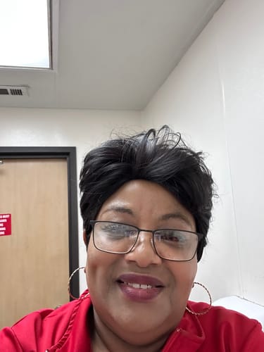 Reviewer smiling in a selfie after using the Seranova Micro Infusion System.