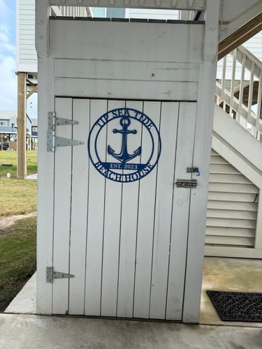 Customer photo review of Beach House Metal Sign
