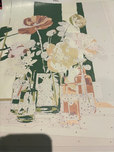 Reviewer starting the 'Beauty in glass' paint-by-number canvas, with initial green and pink colors applied.