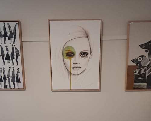 Customer's 'Fused by Leigh Viner' framed canvas art print hung on a wall between two other framed pictures.