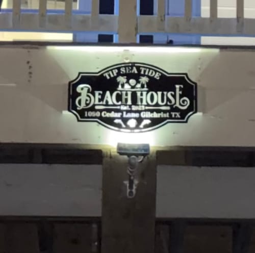 Customer photo review of Beach House Metal Sign