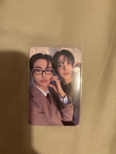 Customer's ATEEZ 'Dear My Muse' lucky draw photocard showing two members, with one in front wearing glasses and making a hand heart.