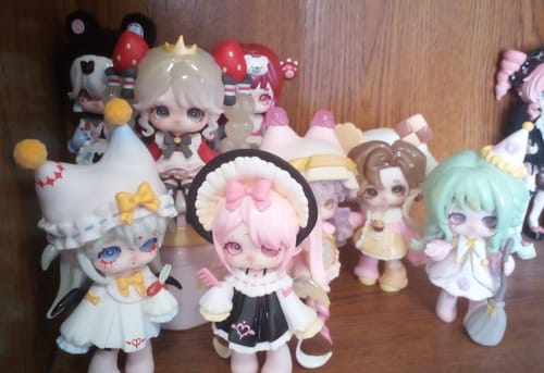 Customer's collection of cute Ninita Mirror Paradise Series figures displayed on a wooden shelf.