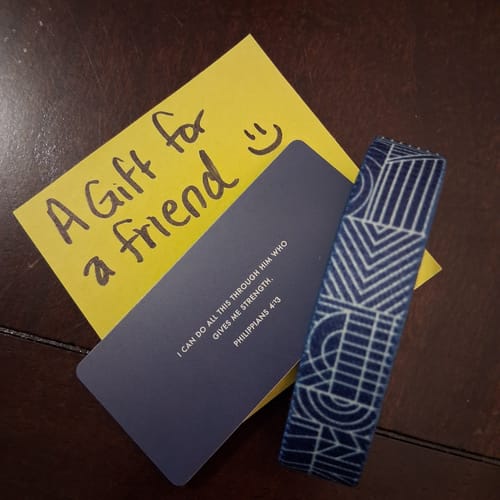 Reviewer's deep blue Bible Verse Bracelet with a geometric pattern, shown with its verse card and a gift note.