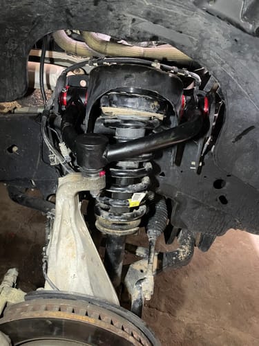 Customer's close-up of the installed 3-inch lift kit with black upper control arms on their Ford F-150.