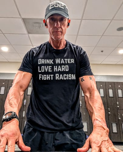 Customer photo review of Drink Water Fight Racism Unisex T-shirt