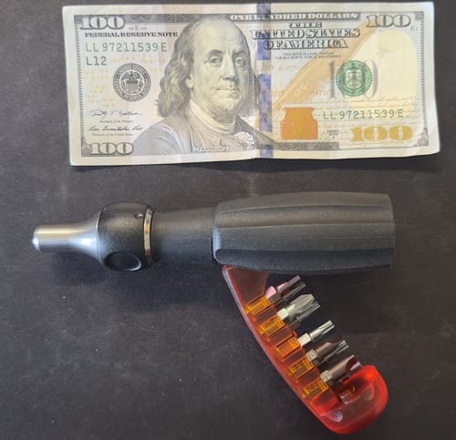 Customer's PB Swiss Tools Insider Pro Ratchet and its bit magazine, shown next to a US hundred-dollar bill for scale.