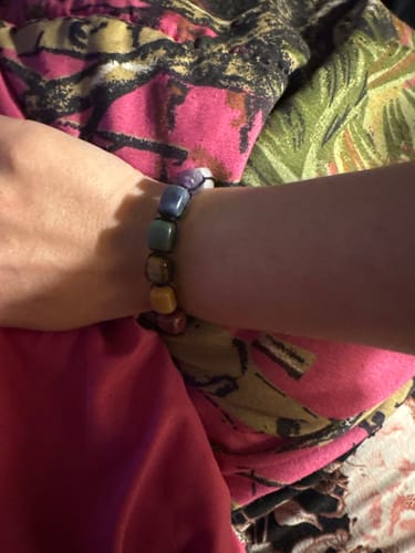 Customer wearing the colorful 7 Shakara bracelet with square crystal beads on their wrist.