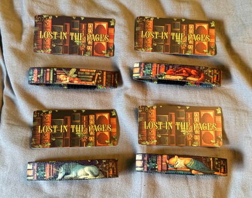 Customer's four Lost In The Pages Bracelets showing the dragon, fairy, unicorn, and griffin designs laid flat.