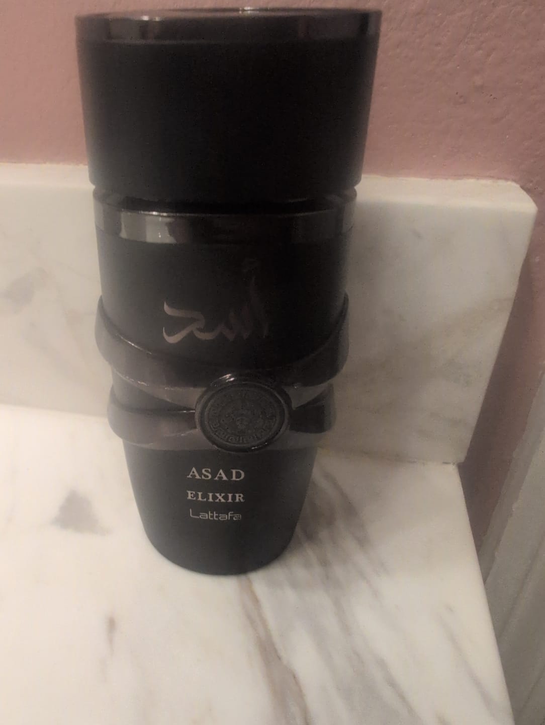 Customer photo review of Lattafa Asad Elixir Eau de Parfum 3.4 oz for Men