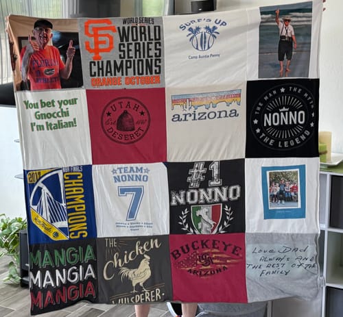 Customer holding their large Project Repat T-Shirt Quilt made from sentimental t-shirts and photos honoring their father.