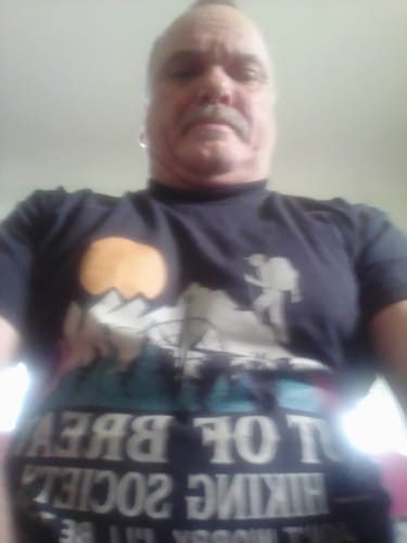 Reviewer wearing the 'Out Of Breath' T-shirt in a low-angle selfie.