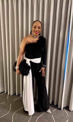 Reviewer posing indoors in the black Suiting Contrast Straight Leg Pant, highlighting the long white sash.