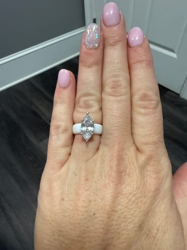 Customer's hand wearing the white Silicone Ring with a large Marquise Cut CZ.