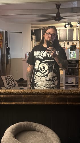 Reviewer wearing the black Death Junkie t-shirt, showing its length in a mirror selfie.