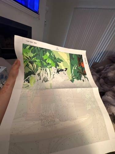 Customer's partially painted Grumpy Cat Paint by Number canvas, showing green foliage and the unpainted numbered sections.
