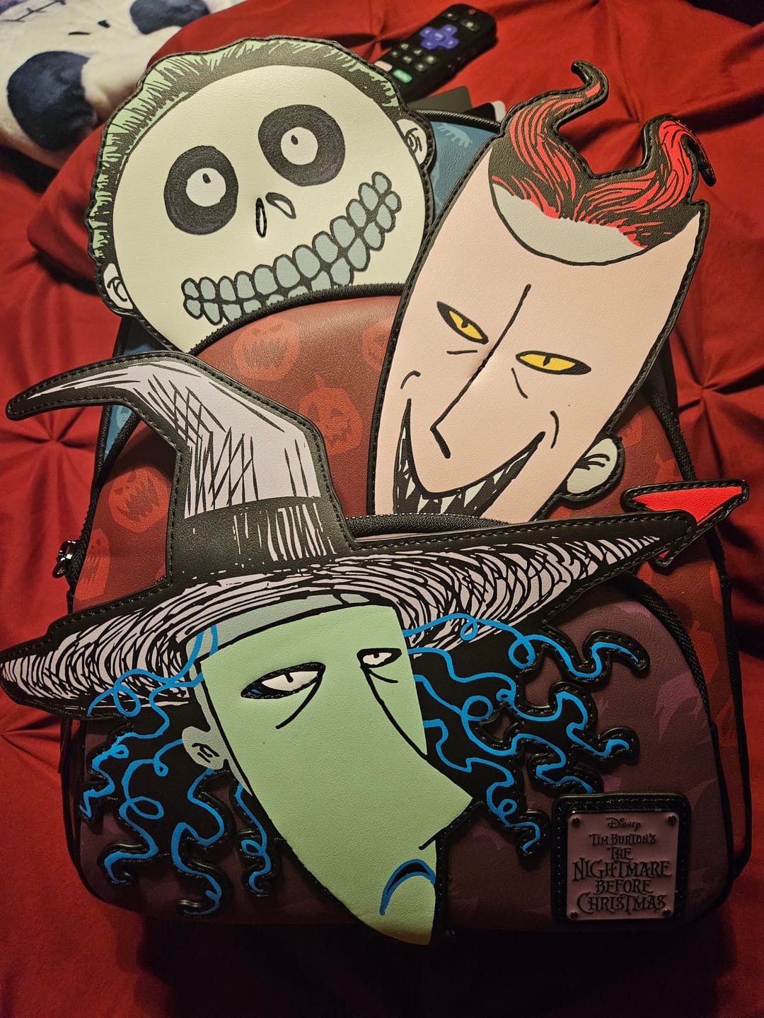 Customer photo review of Loungefly Disney Nightmare Before Christmas Glow in the Dark Lock, Shock, and Barrel Triple Pocket Mini Backpack - 707 Street Exclusive