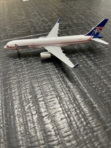 Customer's die-cast Amerijet 757-200WPCF model airplane displayed on a dark surface.