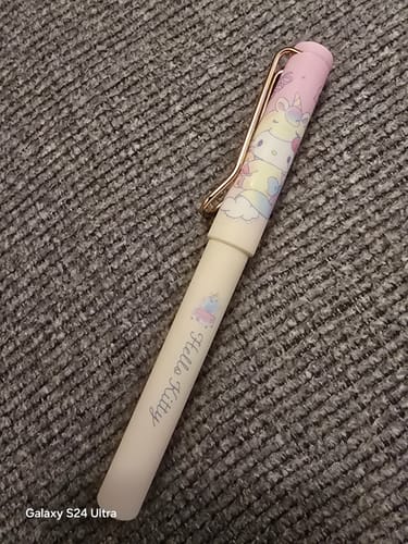 Customer's cute Sanrio Characters gel pen with a Hello Kitty pastel rainbow design.