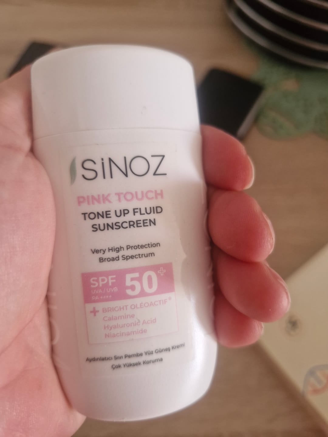 Customer photo review of Pink Touch Tone Up Fluid Sunscreen SPF 50 +