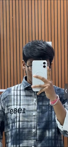 Reviewer's mirror selfie showing the Anti Yellow Magsafe Clear Case on a white iPhone, with the MagSafe ring visible.