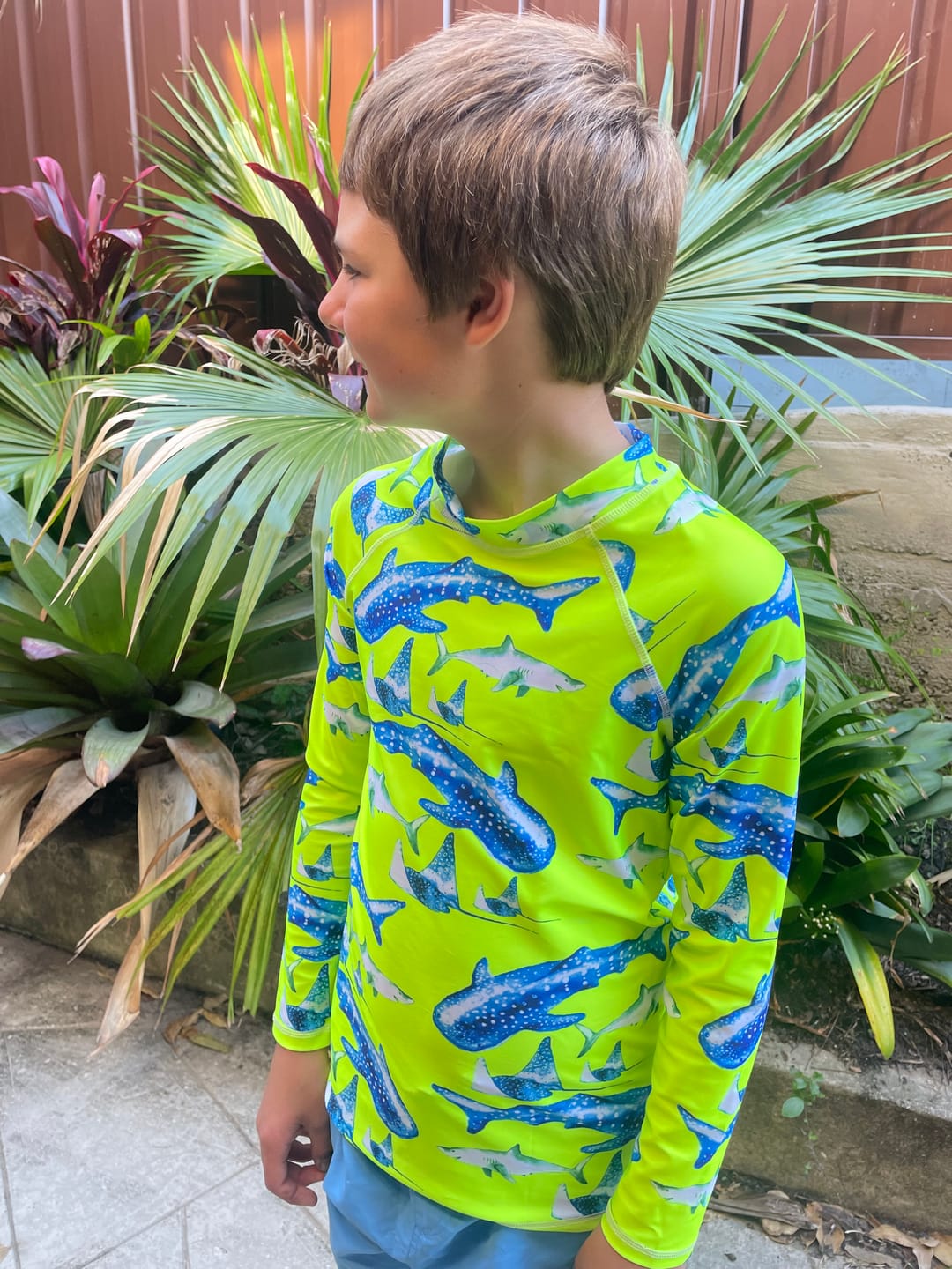 Customer photo review of Fluro Green Sharks Kids' Rash Top