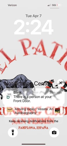 Customer showing the bright San Fermin Wallpaper with 'El Patio' design on their phone's lock screen.