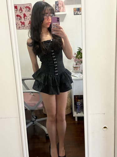 Customer wearing the Grunge Doll Stripes Flared Romper Dress, showing its pinstripe pattern and tiered skirt in a mirror selfie.
