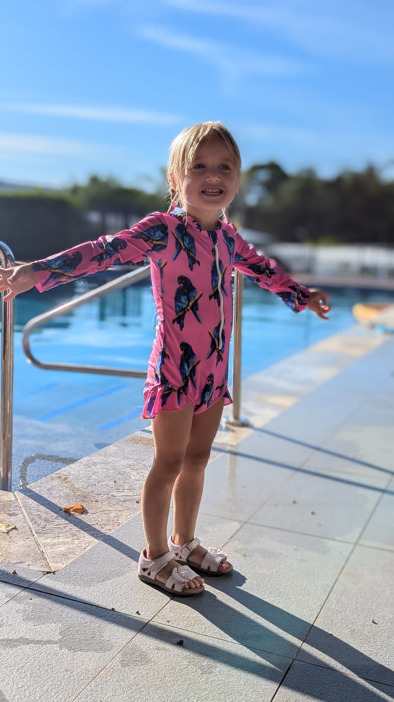 Customer photo review of Fluro Macaw Girls Long Sleeve Zip Swimmers